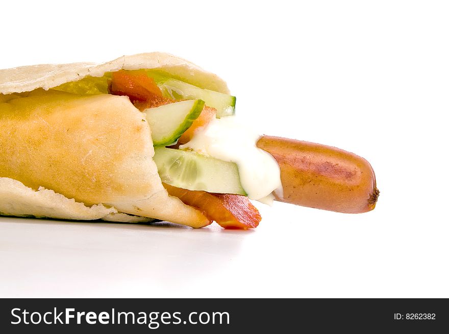 Isolated hot dog with vegetables