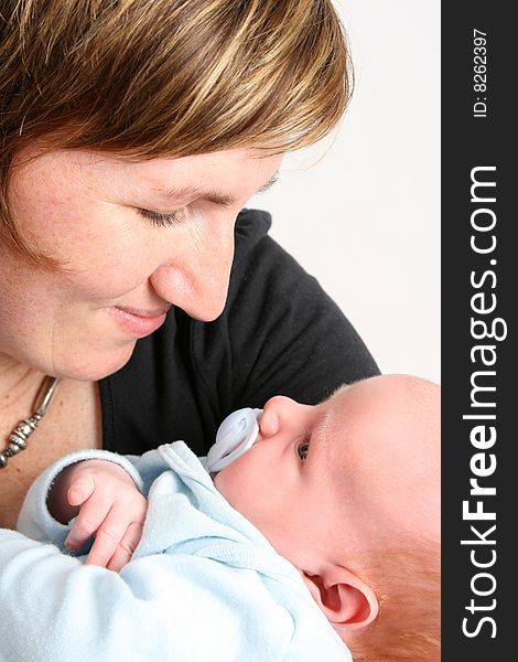 Loving mother holding her new baby boy. Loving mother holding her new baby boy