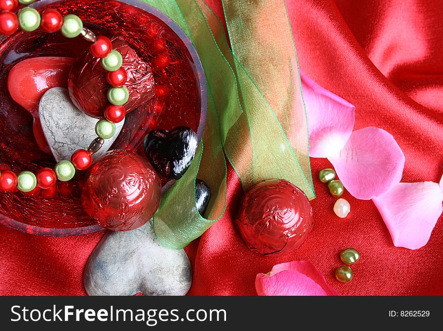 Valetines day hearts in a bowl with jewelery. Valetines day hearts in a bowl with jewelery