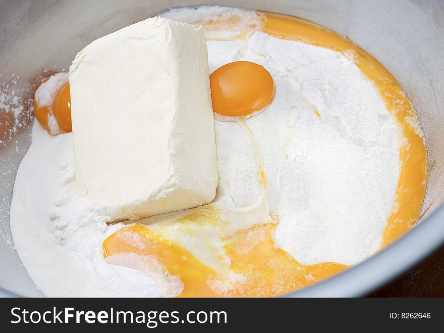 Making a cake with egg flour and butter