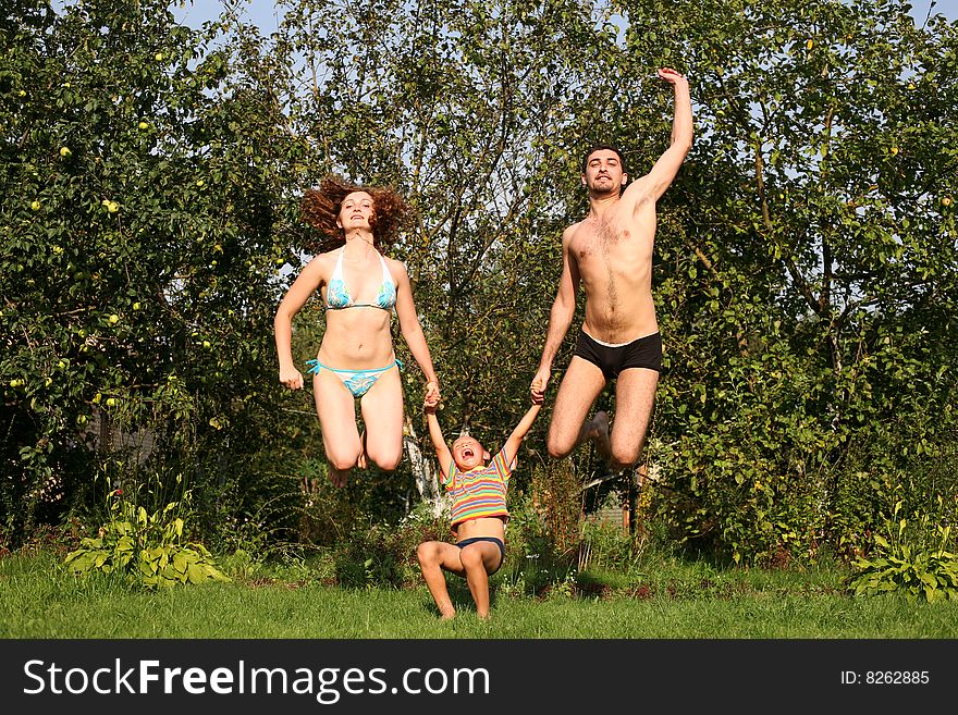 Flying parents and son outdoors