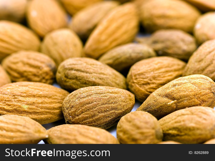 Almond Nuts - Close up for pile of almond nuts as whole background.