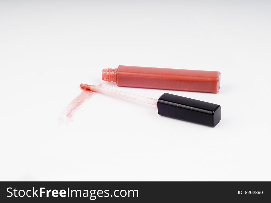 Pink gloss for lips on white background. Pink gloss for lips on white background
