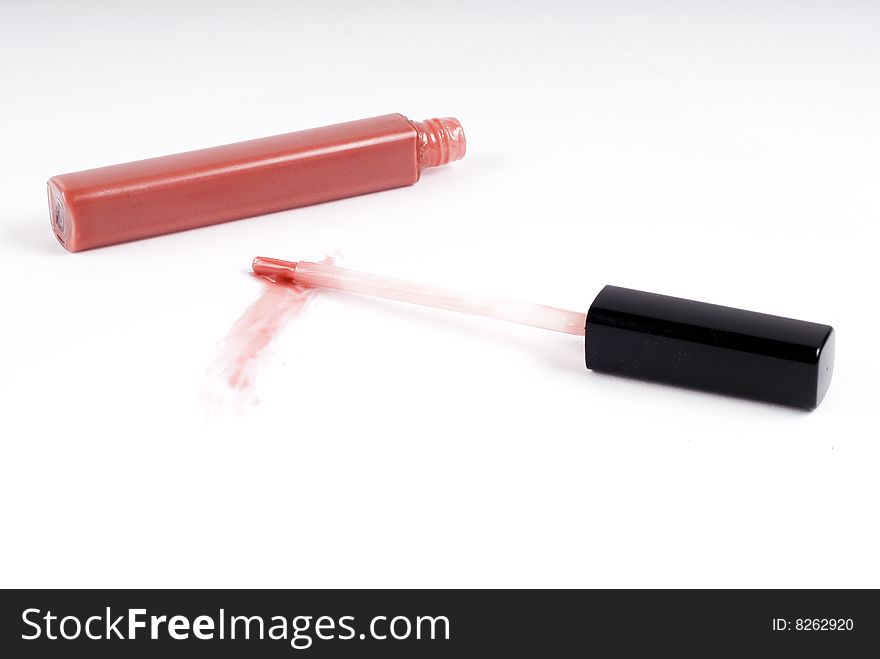 Pink gloss for lips on white background. Pink gloss for lips on white background