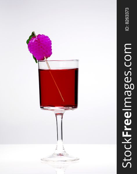 Red cocktail glass on a clean white background