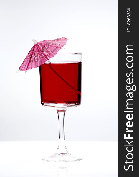 Red cocktail glass on a clean white background