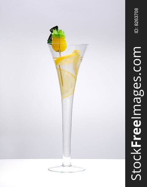 Cocktail with lime isolated on the white. Cocktail with lime isolated on the white