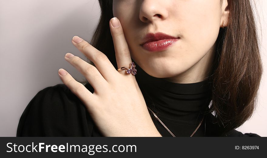 Portrait of the girl with a ring on a hand close up. Portrait of the girl with a ring on a hand close up.