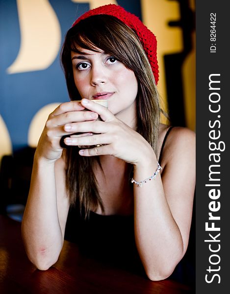 A beautiful young woman having lucnh in a cafe