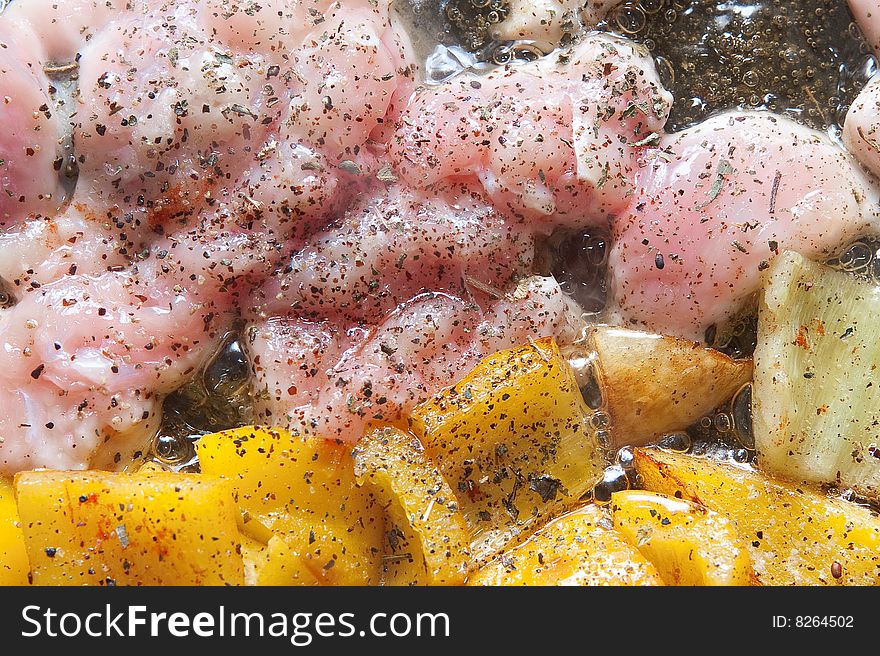 Chicken meat frying with yellow peppers. Chicken meat frying with yellow peppers