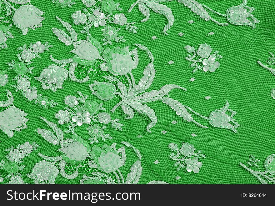 Silk green  lace ornament color texture. Silk green  lace ornament color texture