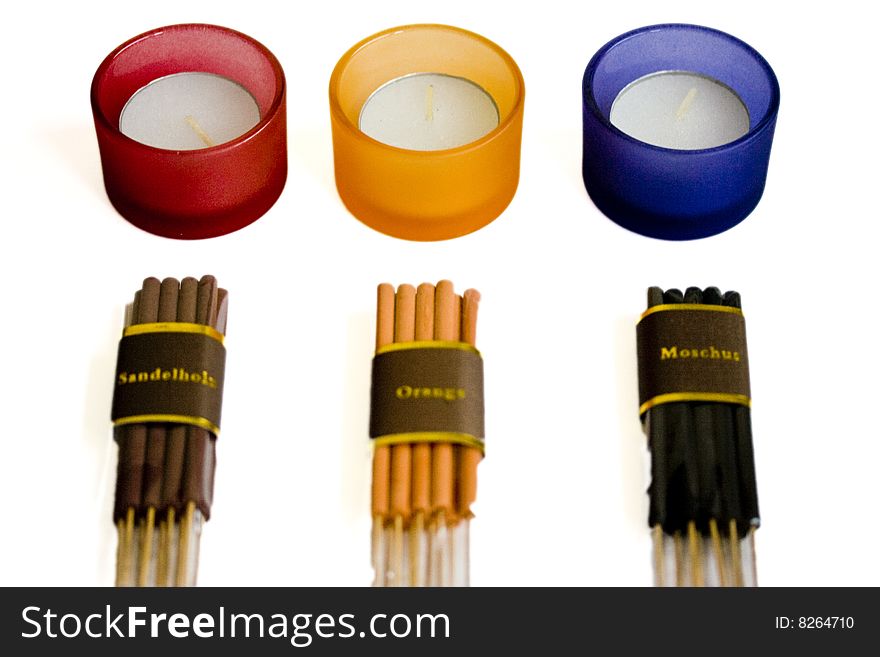 Candles and aromatic sticks isolated on white