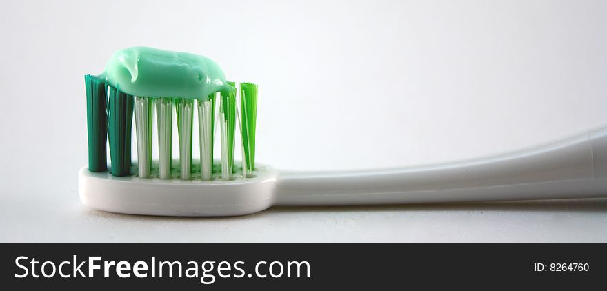 Toothbrush and toothpaste isolated on white.