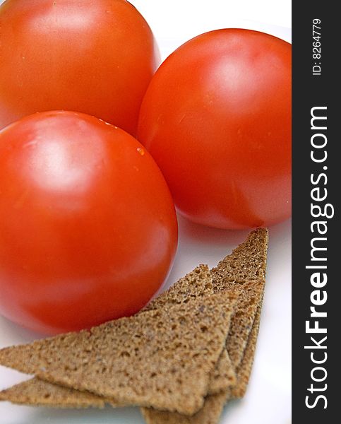 Red fresh tomato and bread. Red fresh tomato and bread