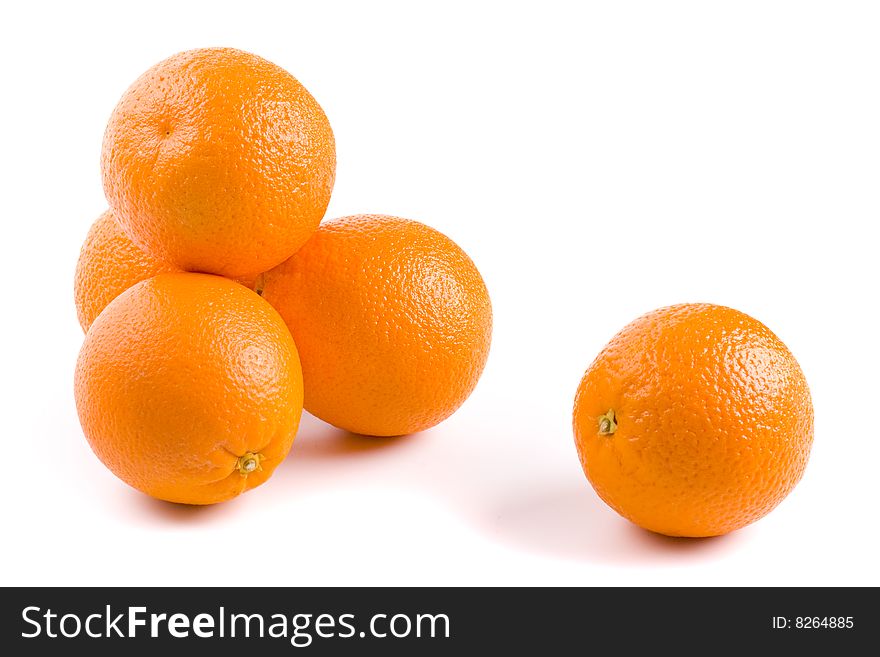 Five fresh oranges on white background