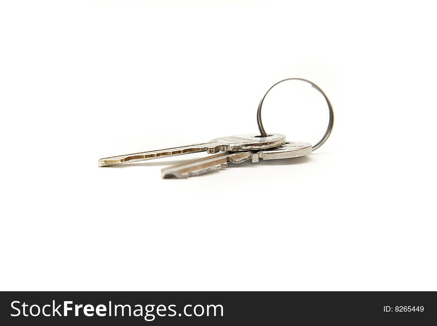 Two keys over white background