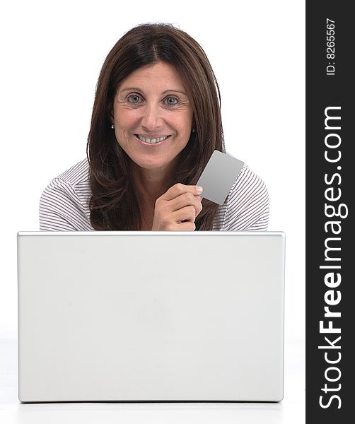 Woman buying online on a laptop with a credit card
