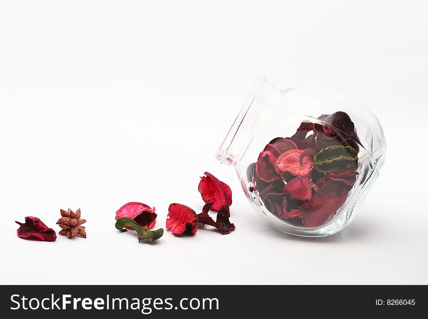 Petals and glass bottle