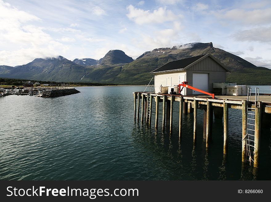 Norwegian mountains seen from a small harbor. Norwegian mountains seen from a small harbor.