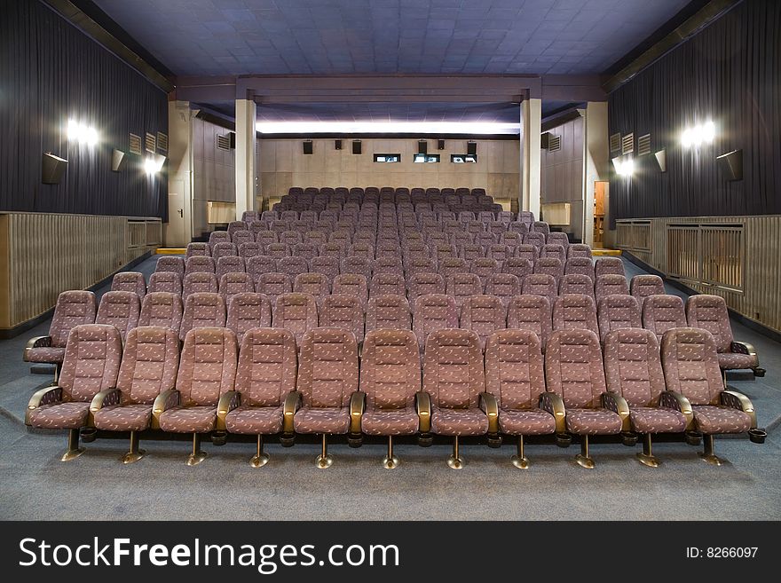 Empty new cinema auditorium with rows of chairs. Empty new cinema auditorium with rows of chairs.