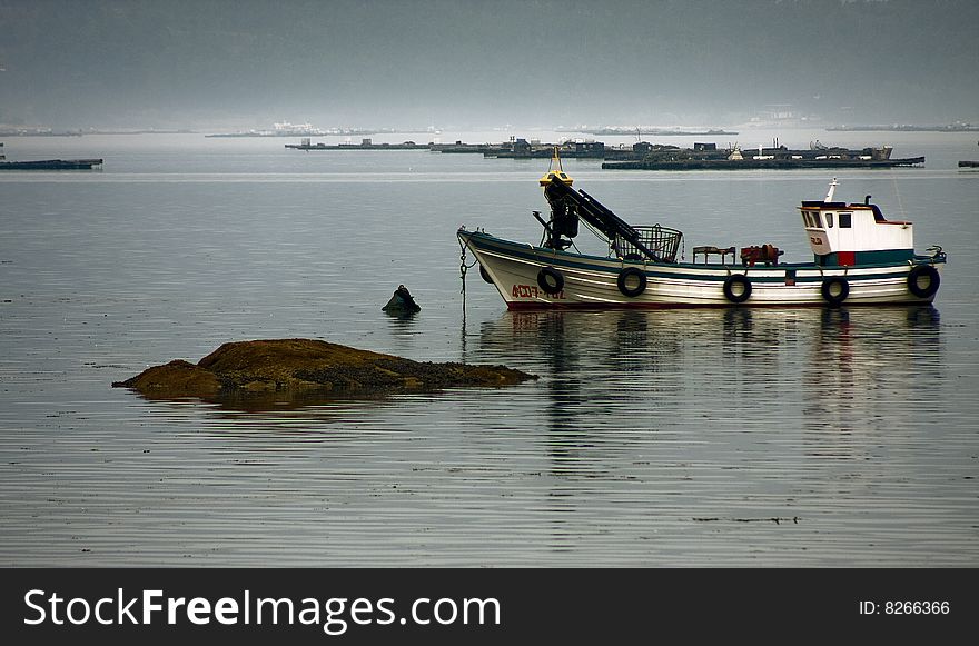 Fishing boat at anchor, seascape
