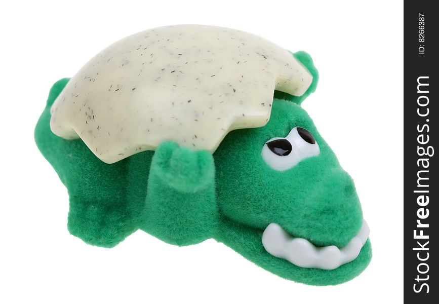 Funny green crocodile toy with shell on white background. Funny green crocodile toy with shell on white background