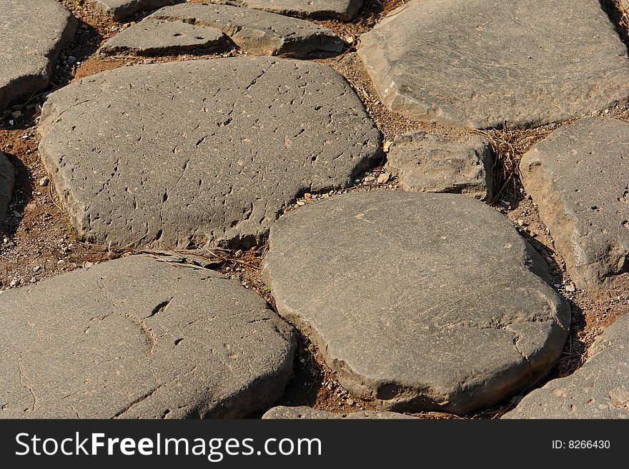 Very old roman stone pavement near the Colosseum , Italy. Very old roman stone pavement near the Colosseum , Italy