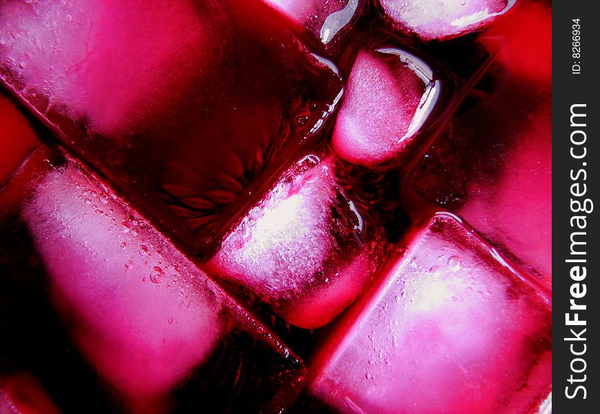 Macro photo of pink ice in a pink alcoholic beverage. Macro photo of pink ice in a pink alcoholic beverage.