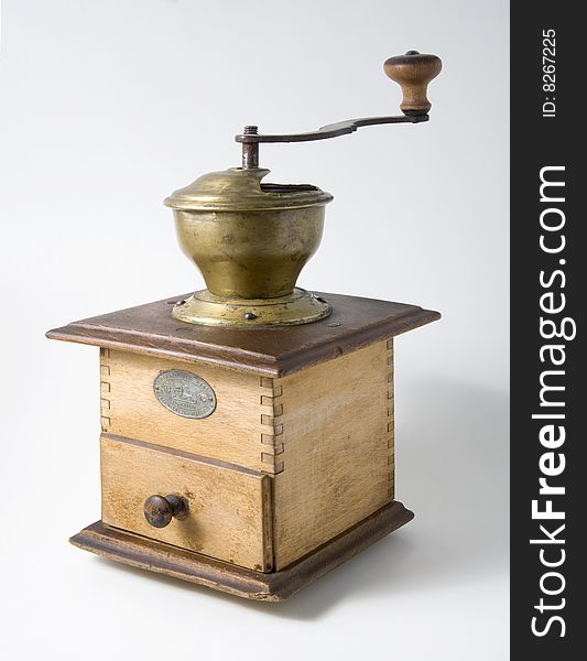 Old coffee grinder on a white background