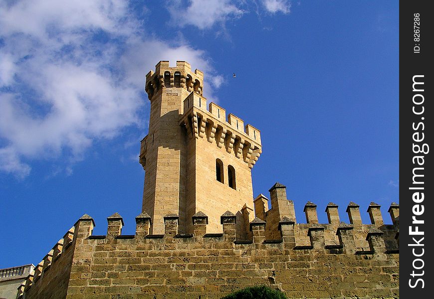 Spanish castle against blue cloudy sky