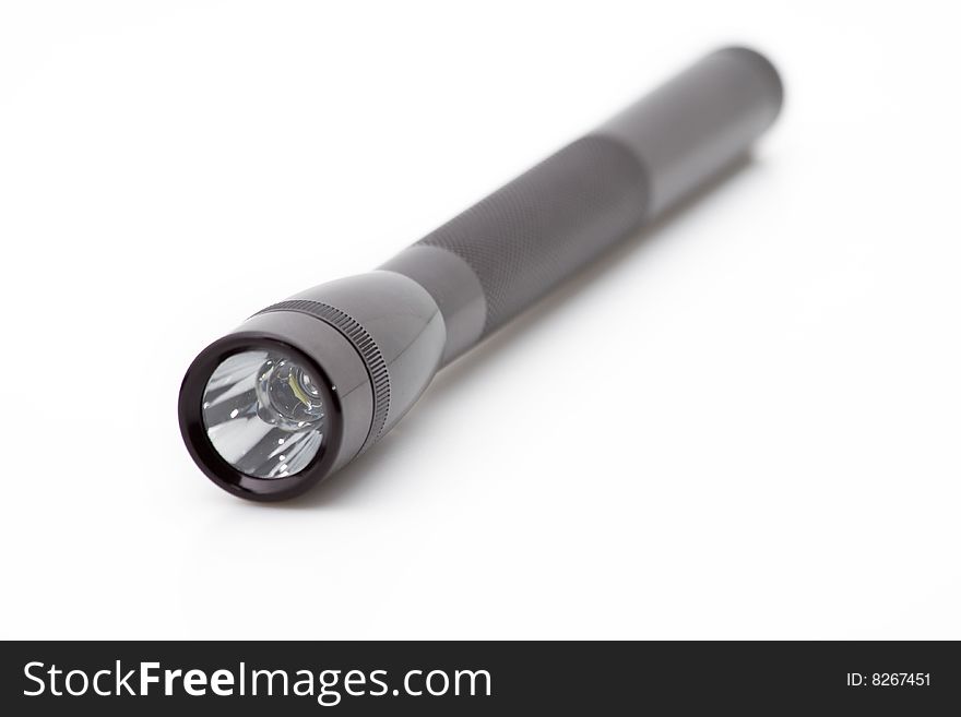 A close up of a black flashlight