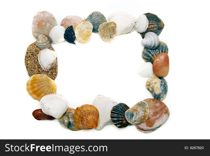 Frame from seashells and stones over white