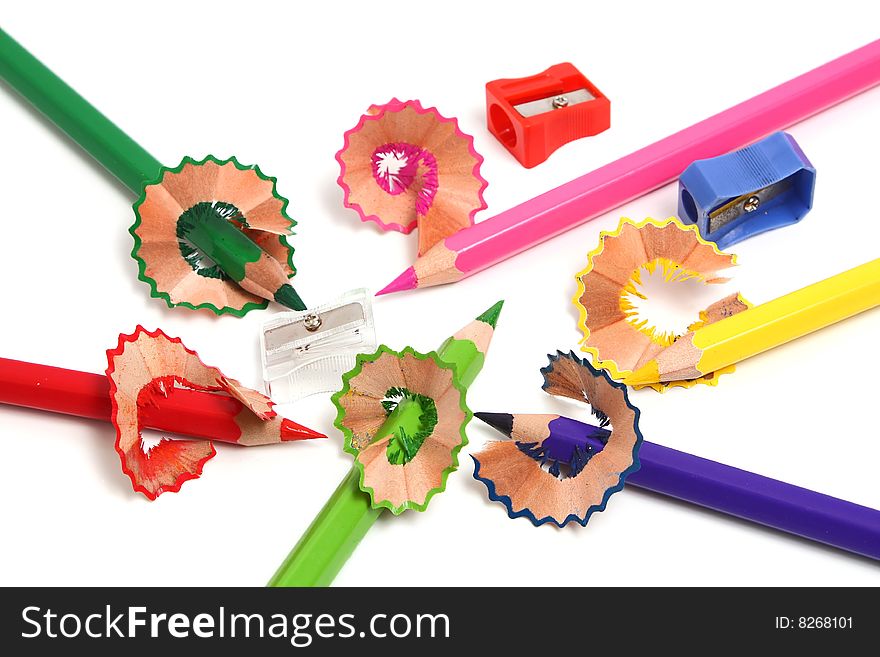 Colors sharp pencils sharpener and shaving isolated on white background