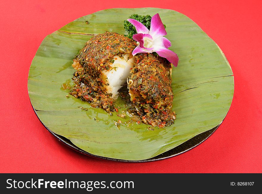 A fish restaurant row on white dish. A fish restaurant row on white dish