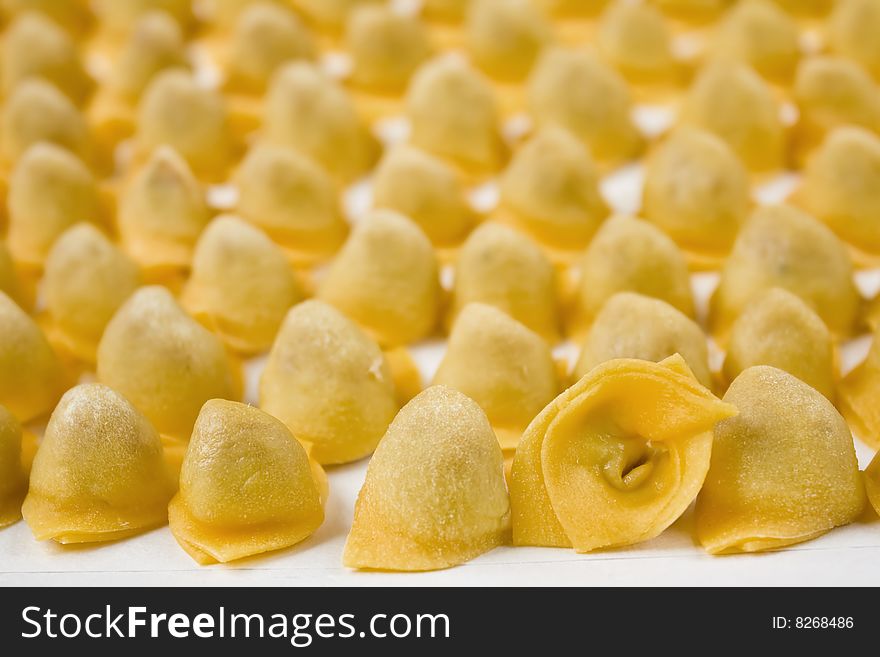 Closeup of italian tortellini on white background