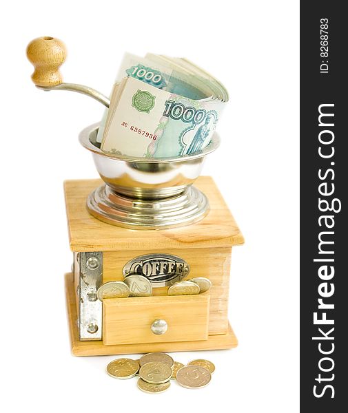 Soft money are grinded in coffee mill and become coin. Soft money are grinded in coffee mill and become coin