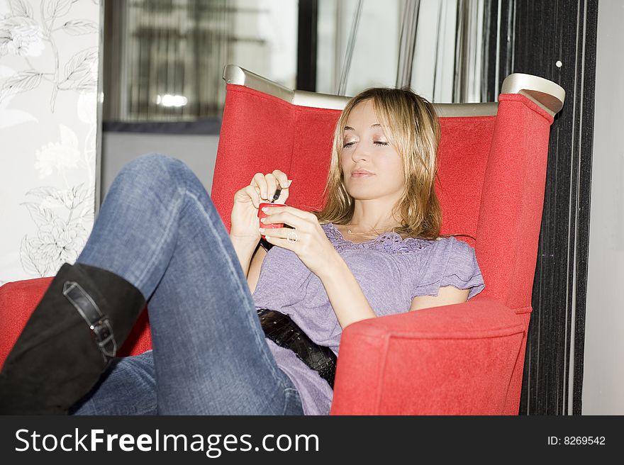 Beautiful woman eating yogurt at home