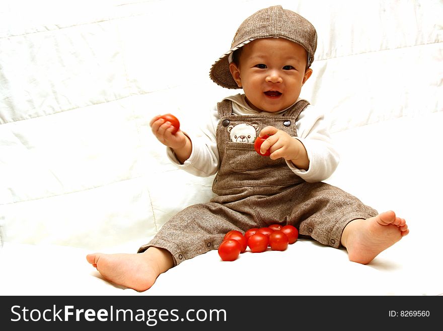 Cute Asia child with Tomato. Cute Asia child with Tomato