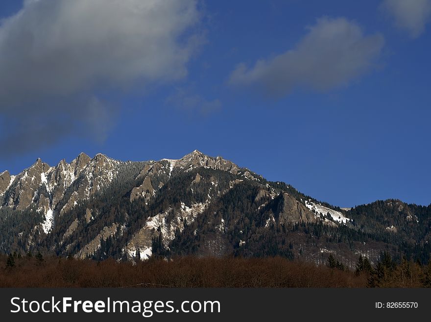 Clouds And Snow On Mountains