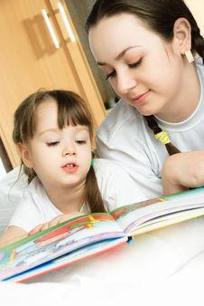 Mother And Daughter Reading A Book Royalty Free Stock Photo