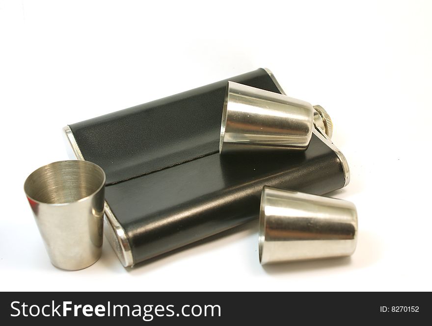 Flask for alcohol and several metall wine - glasses. Flask for alcohol and several metall wine - glasses.
