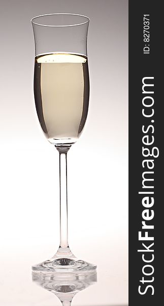 An isolated glass of champagne.