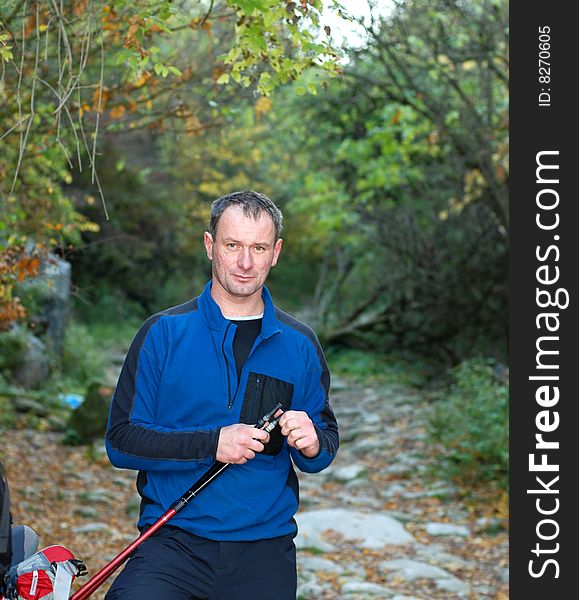 Clear morning. Hiker prepares for travel