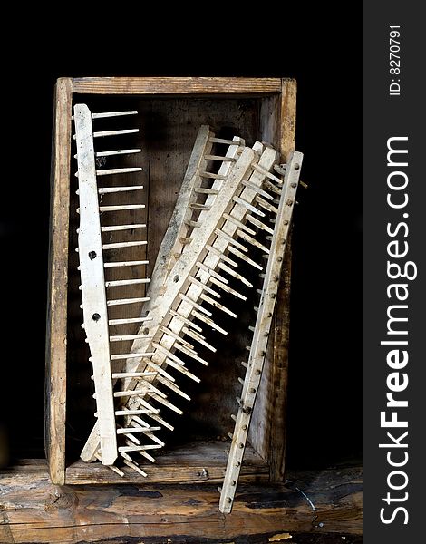Stock photo: an image of rakes in old wooden box