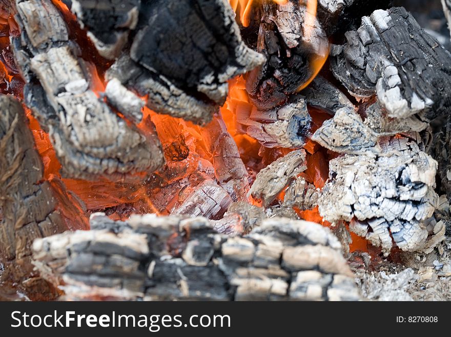 Stock photo: an image of fire on half-burnt logs. Stock photo: an image of fire on half-burnt logs