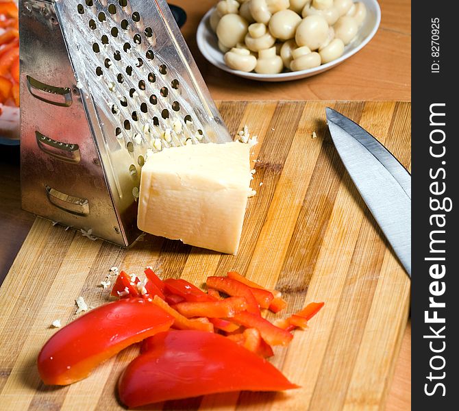 Stock photo: an image of food in the kitchen: mushrooms, paprika and cheese. Stock photo: an image of food in the kitchen: mushrooms, paprika and cheese