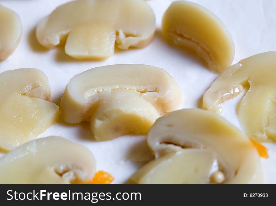 Stock photo: an image of a background of mushrooms on dough