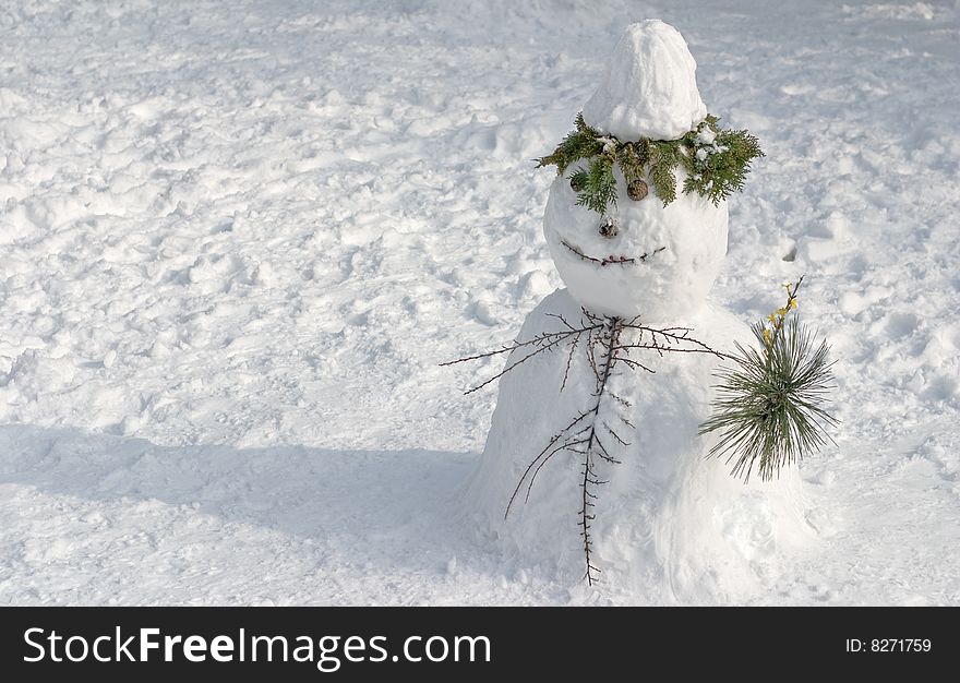 Snowman on snow covered field in park