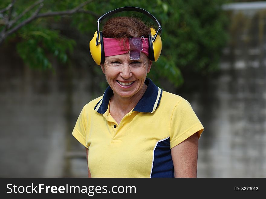 Smiling Female Competitor At Shooting Range