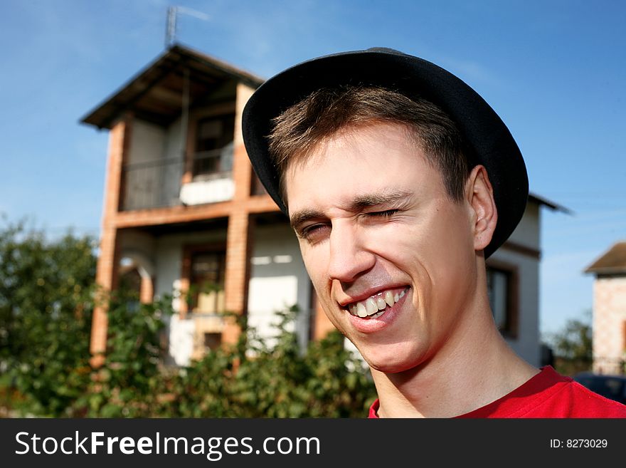 Young happy man at him new house. Young happy man at him new house